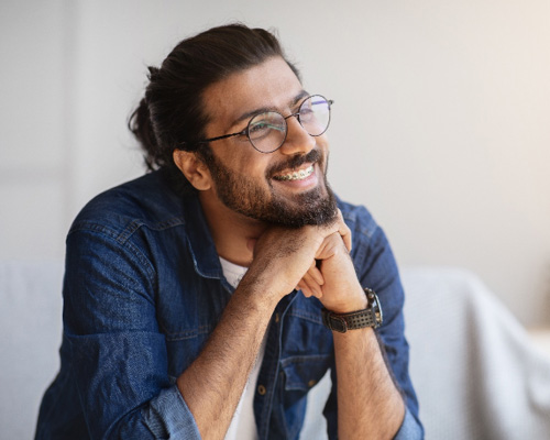 Man smiling with braces