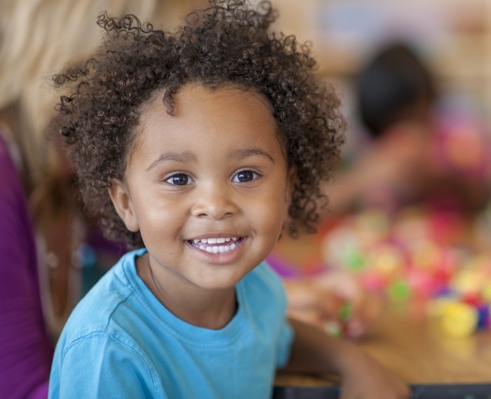 Child smiling after visiting childrens dentist in Pleasanton