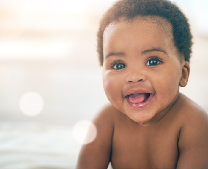 Baby smiling after visiting dentist for infants in Pleasanton