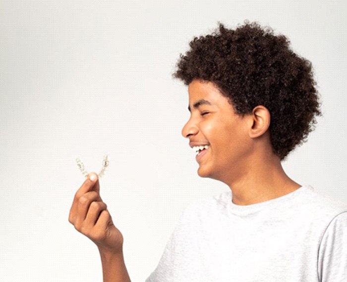 Teen is pleased by Invisalign clear aligner