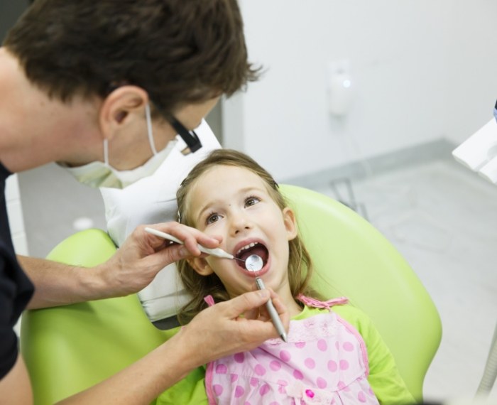 Young girl receiving a dental checkup from her pediatric dentist in Pleasanton