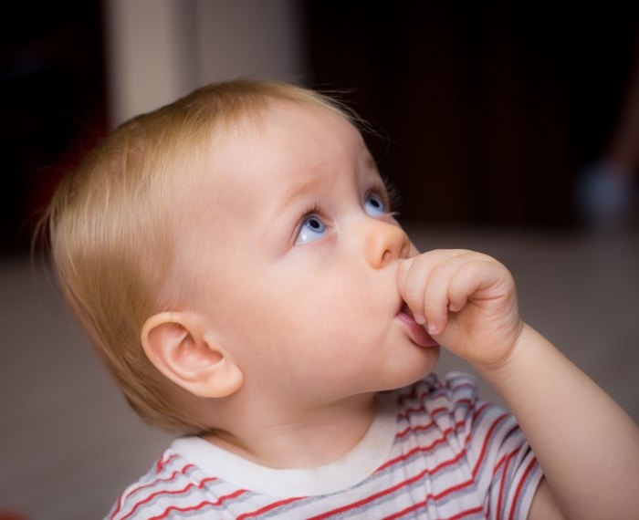 Baby sucking their thumb