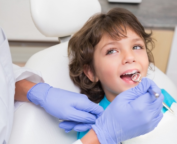 Young boy receiving a dental exam