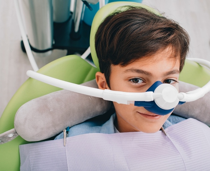 Young boy wearing nose mask for nitrous oxide sedation dentistry in Pleasanton
