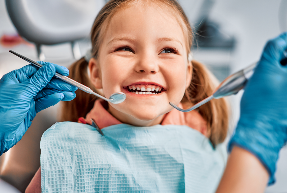 Little girl smiling in dental chair